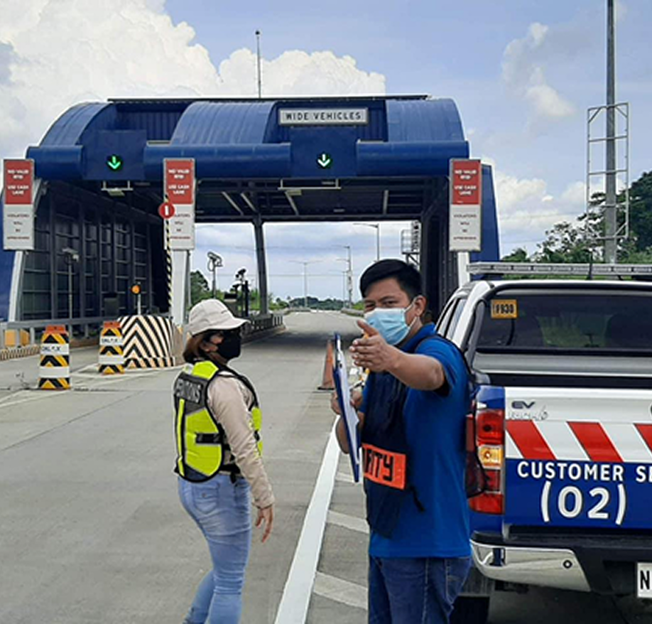 Safety officers conducting an inspection at a roadside checkpoint